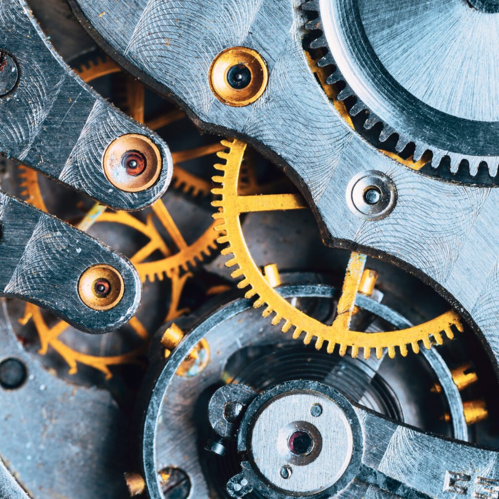 close up of old clock watch mechanism. retro clockwork watch with gearwheels gears. vintage movement mechanics.